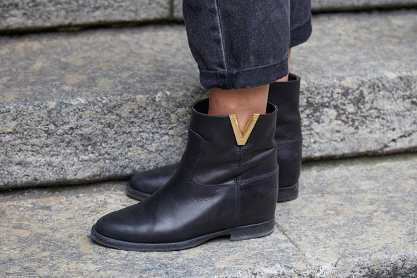 Black Valentino Boot with Gold Accent V and Gray Denim Jeans